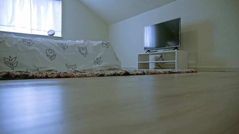 Upstairs bedroom #1 with TV.