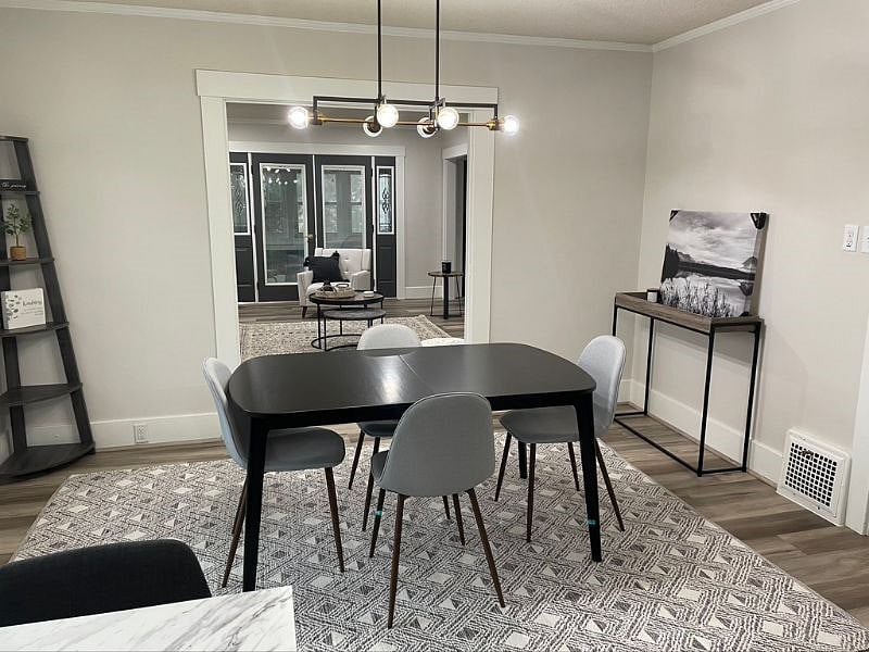 Large dining room that connects to living room. There is a leaf to extend the table to seat 6