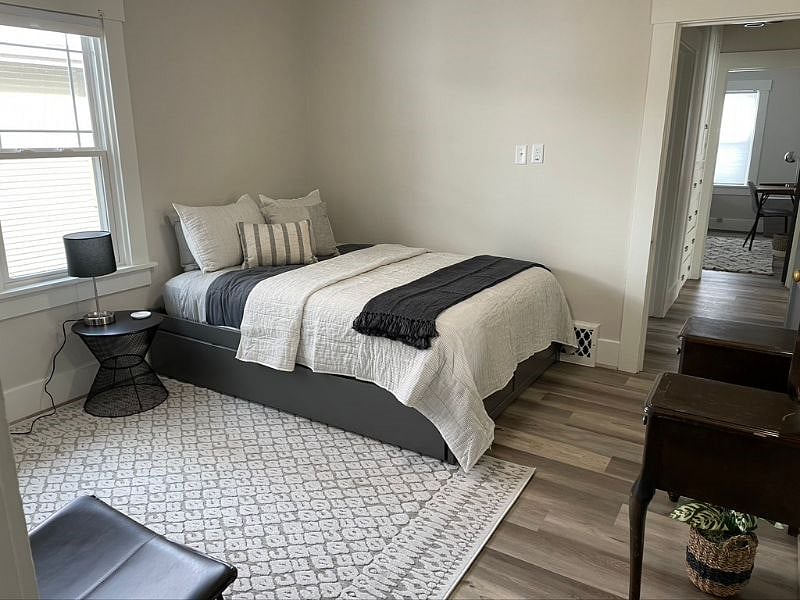 Bedroom 1 with queen bed and a pull out twin trundle bed below