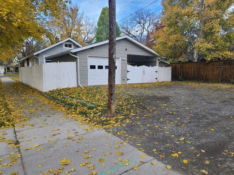 Rear of house showing garage for main 2 bedroom home. The carport area on right is for basement unit