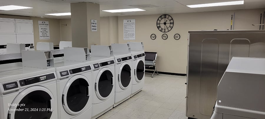 Laundry is a breeze with this laundry room.  Easily do multiple loads in the front loading washers and dry quickly.