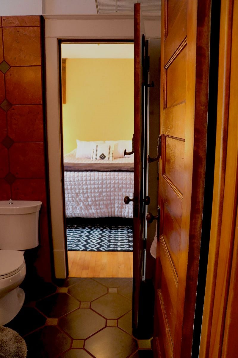 View of middle bedroom through the jack and jill-style bathroom