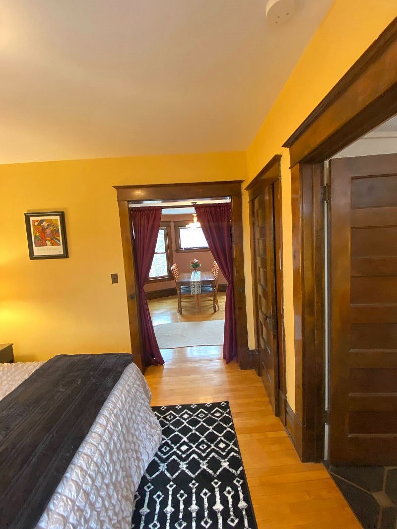 View from bedroom into dining room. Curtains close for privacy and quiet.