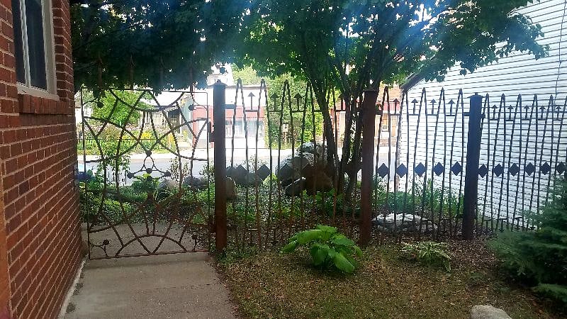 Unique handcrafted metal fence and gate