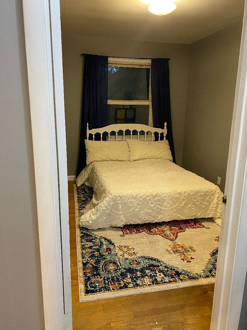 smaller room with a full bed