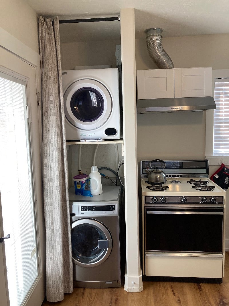 Electrolux front loading washing machine and compact dryer. Ducted rangehood with gas range. There is a clothes line outside which I highly recommend. You will want for nothing