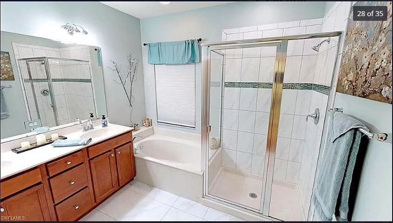 Huge Master Bath with separate soaking tub, glass door shower and water closet