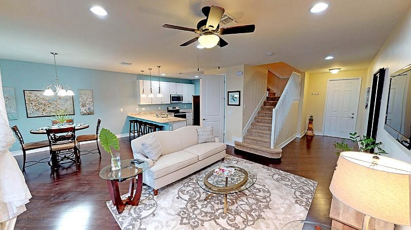 Living and Dining Room looking out to Foyer and staircase