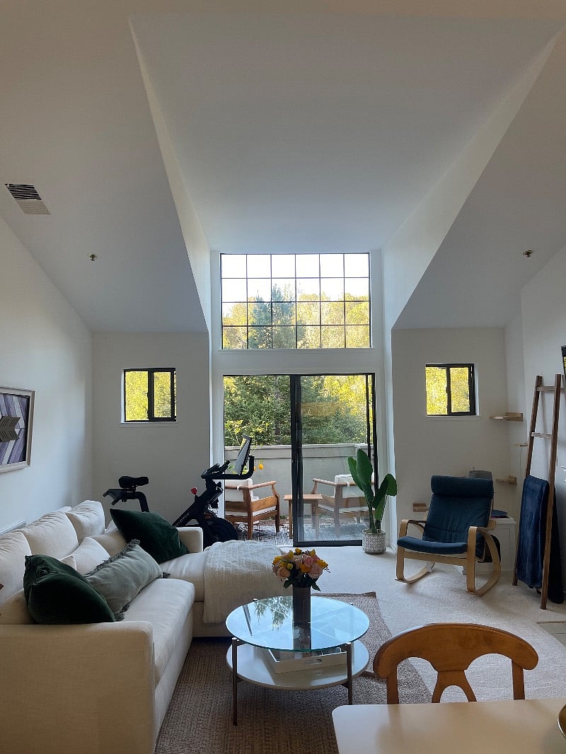 Large windows provide natural light, making the shared space feel very open.