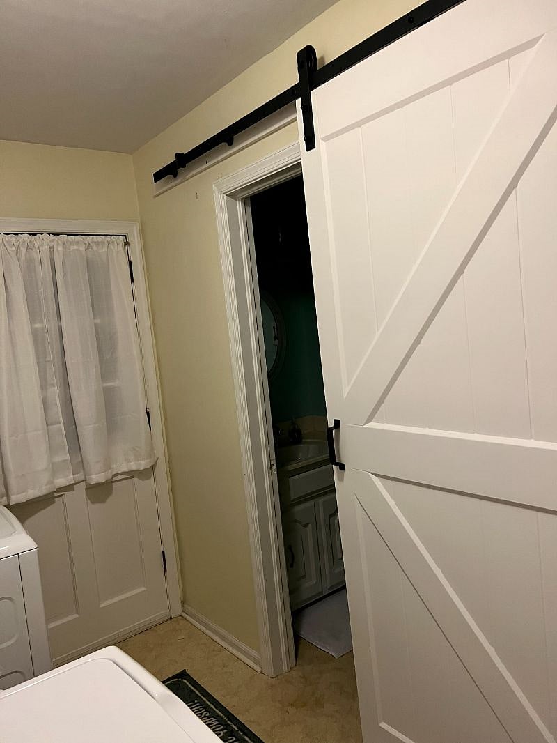 This is the laundry room and half bath closest to the pool. This back door leads out to a screened porch with a ceiling fan. There is also a (fire) door to the garage on the other end of this room. There are 4 total doors in this room (for reference).