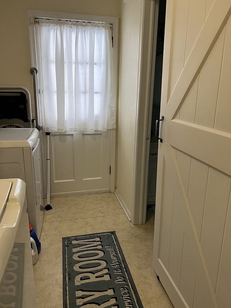 Laundry room - half bath barn door, door to the porch, washer, and (gas) dryer.