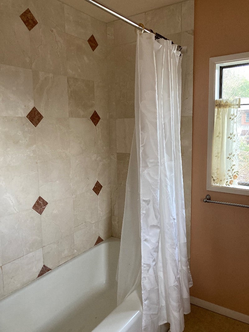 Beautifully tiled shower and generous tub for soaking