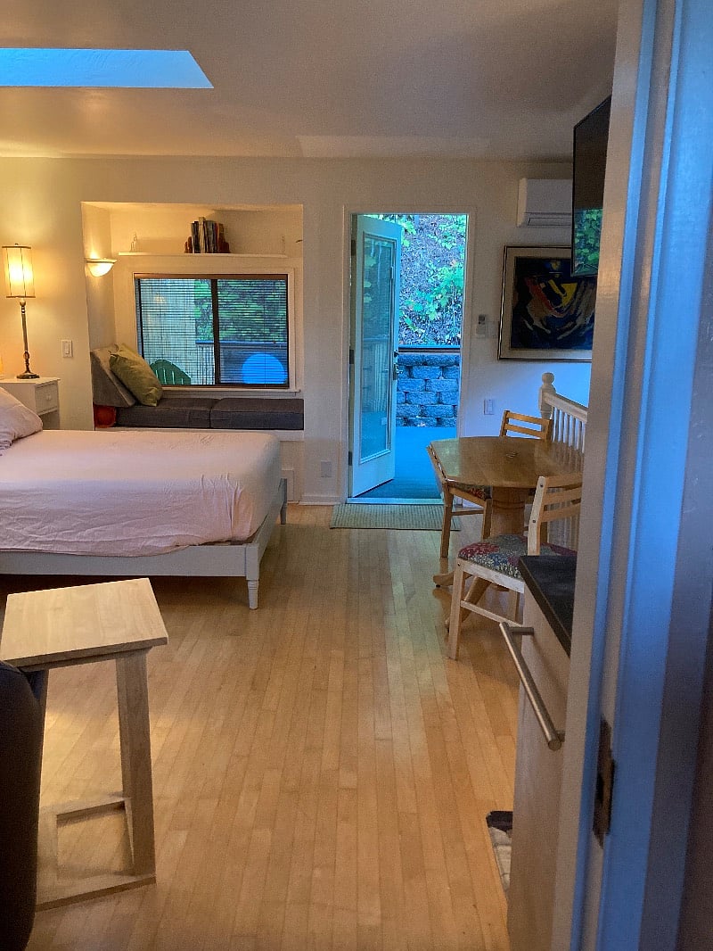 Shows new queen-sized bed and entrance from deck