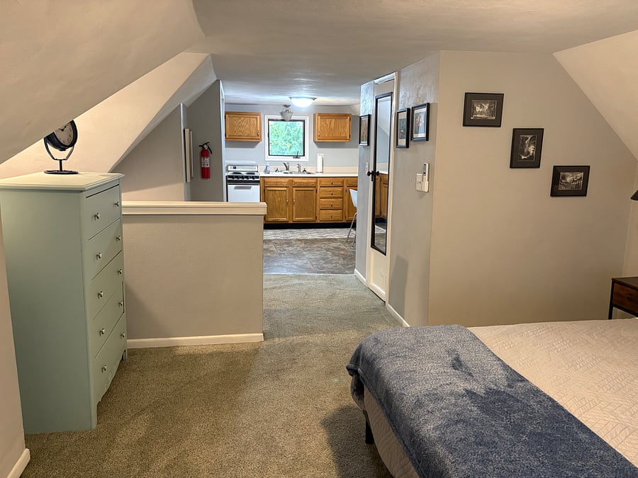 This is the top floor of the bi-level apartment, open concept loft. Full kitchen, electric range, full bath and bedroom on the top floor. 