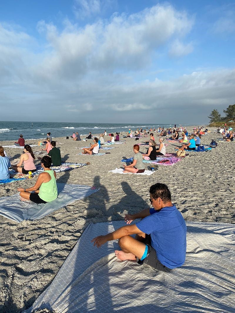 Daily beach yoga on public beach.  