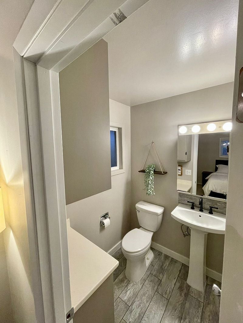 Primary bedroom with half bath ensuite.