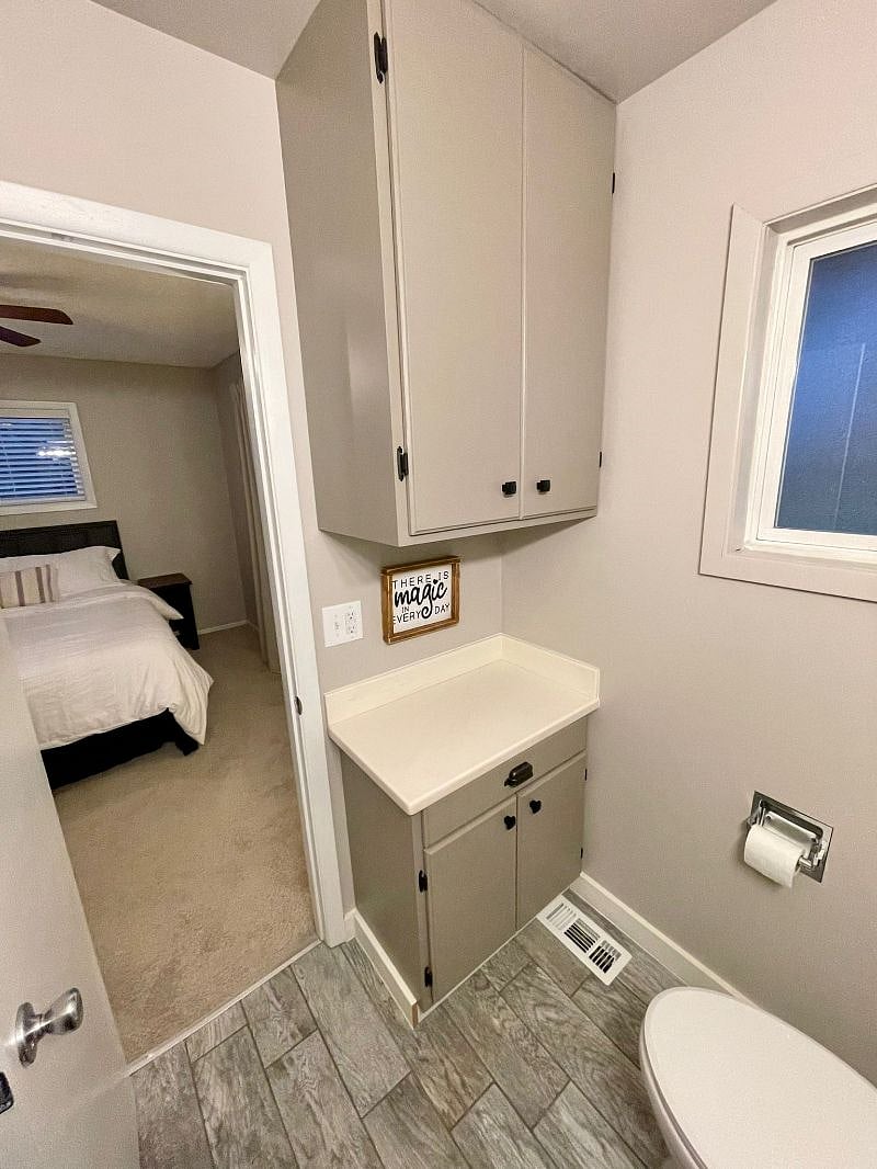 Primary bedroom with half bath ensuite.