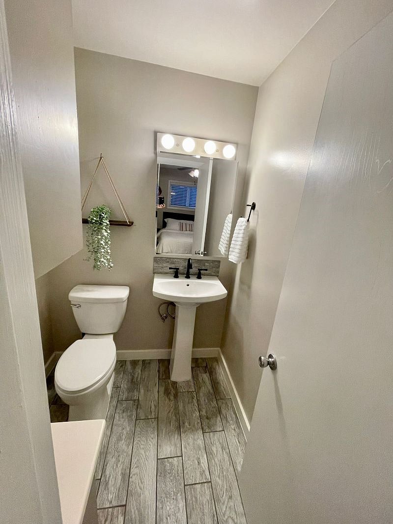 Primary bedroom with half bath ensuite.