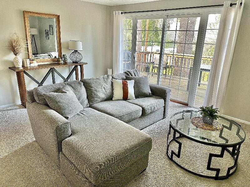 Living room with 65" smart TV with entry to deck overlooking large fenced in backyard.
View video walk through here:
https://youtu.be/dNdPRkJrlbo
