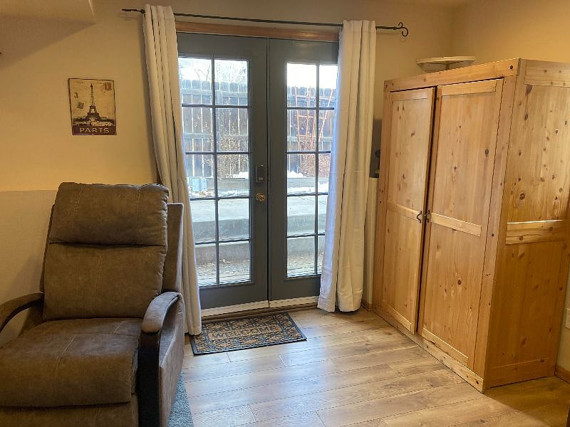 Brand new comfy recliner, 2 extra folding chairs in closet for company.