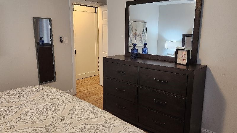 2nd Bedroom. King. dark furniture, sheets just back from cleaners