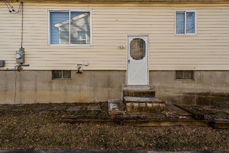 Side Access to Upper Level and Basement. Access to Back Yard.