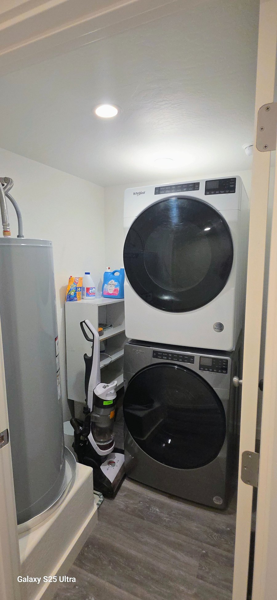 Laundry room with stacked washer and dryer