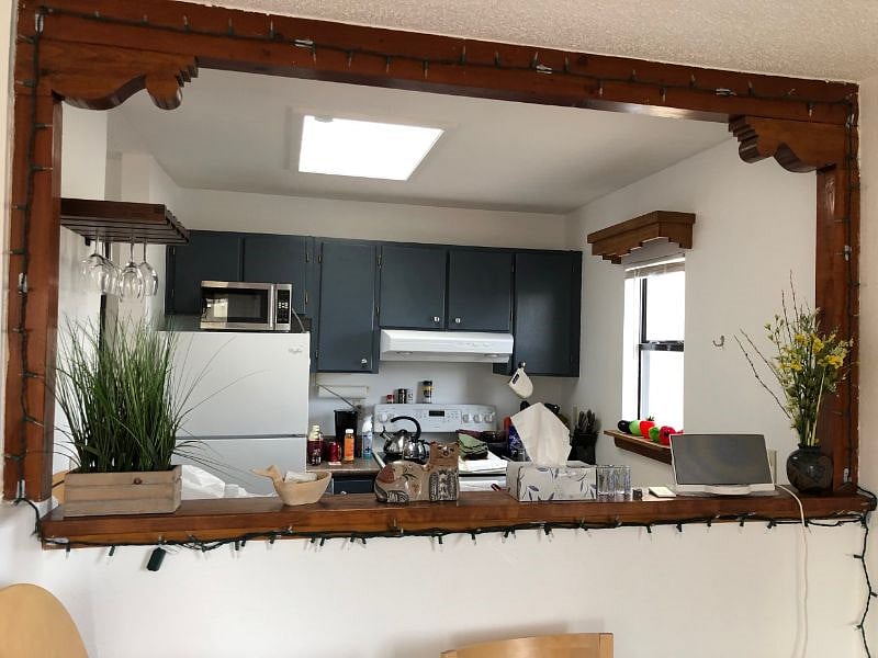 Pass thru from dining to kitchen so you can stay connected