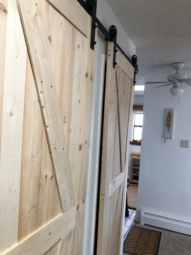 Near door is to bathroom, far is to pantry stack W/D laundry and storage.