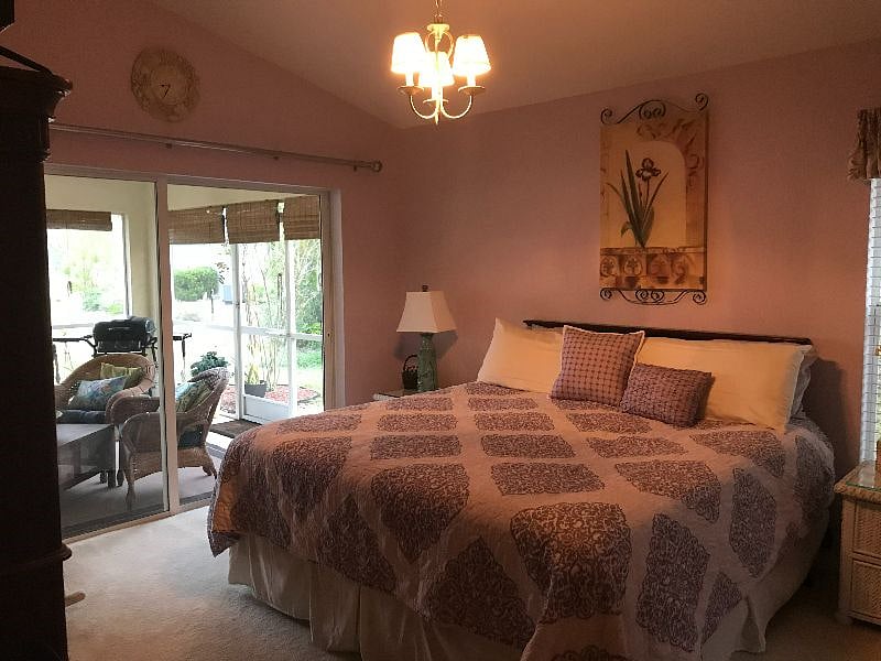 King size bed in Master Bedroom with access to lanai.