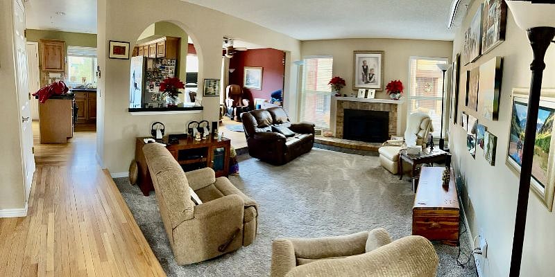 Family room with the kitchen on the left and the sitting area on the right. Notice the! fireplace.