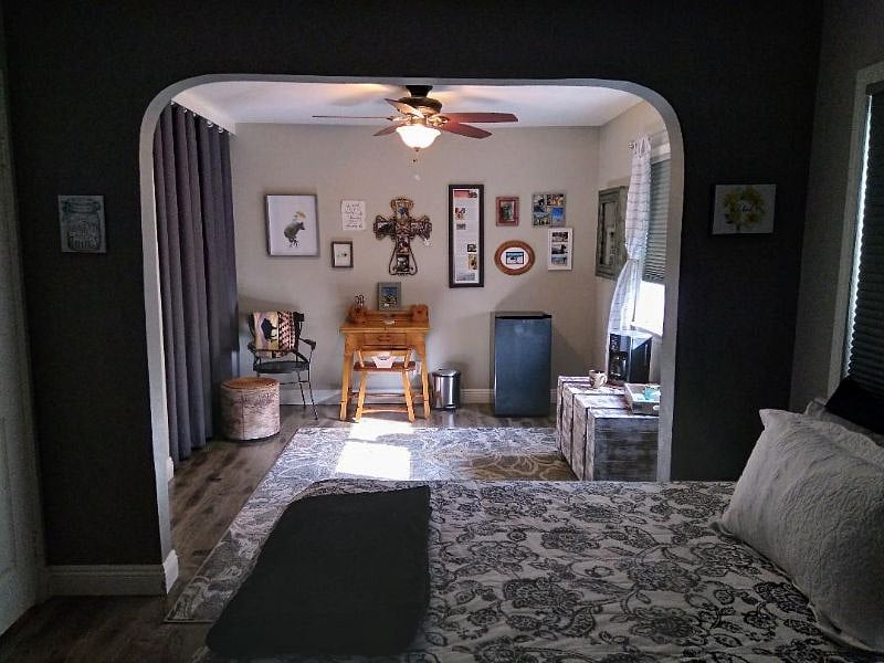 Small desk, ceiling fan, mini frig, black out blinds and coffee maker.