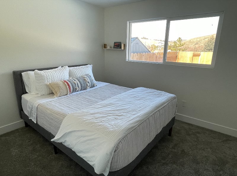 Bedroom 2 - Queen sized bed, new carpet and view of backyard and foothills