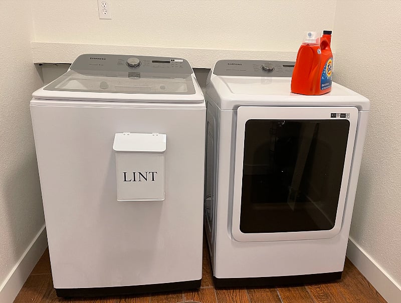 Large laundry room with brand new washer and dryer