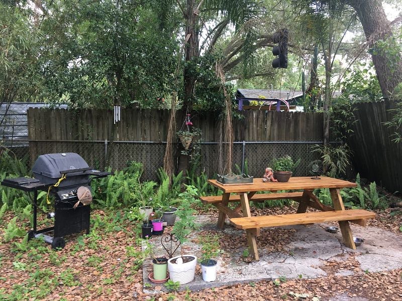 Backyard picnic area with grill