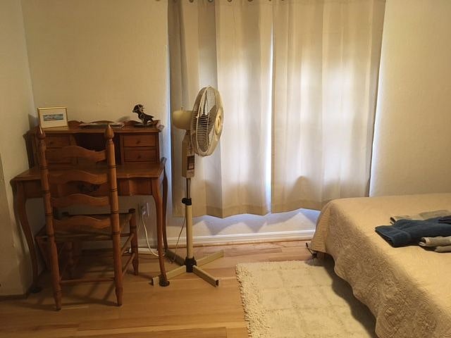 Antique writing desk & rotating floor fan (for those who like more air circulation)