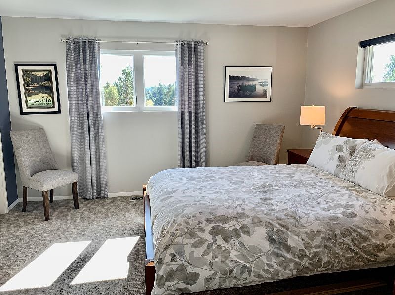 Main bedroom features queen bed, and views to East and South as well.