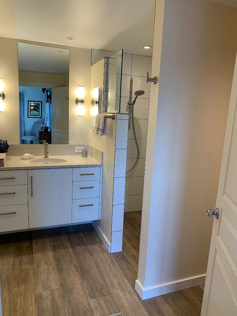 Recently remodeled master bath has walk-in shower, heated floor, dual sinks, tons of storage, and toilet nook