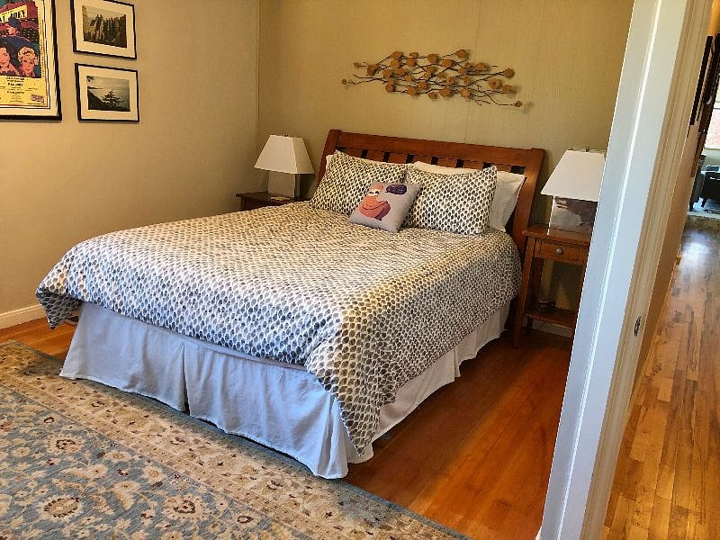 2nd bedroom features queen bed, closet, and views to North and East.