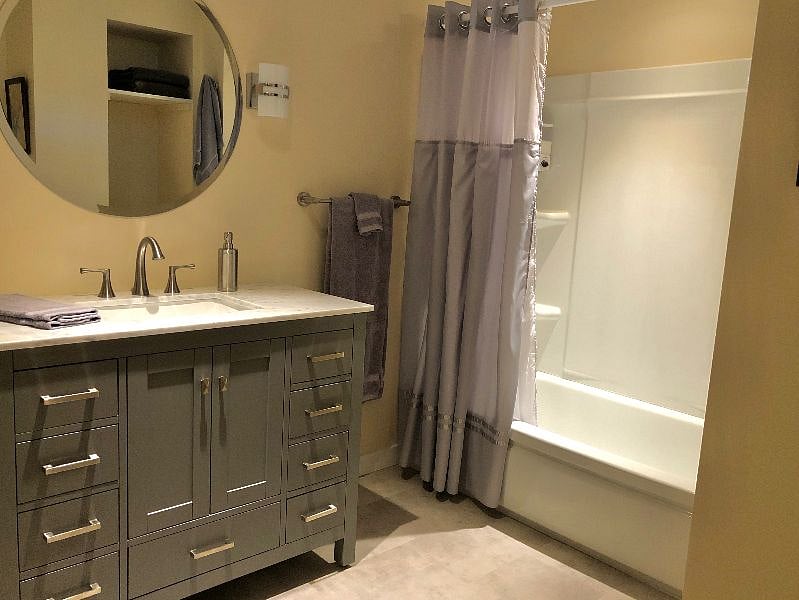 2nd bath, also recently remodeled, features tub/shower combo, vanity with storage, and toilet nook.