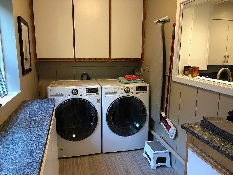 Laundry room has full-size front-loading washer & dryer.