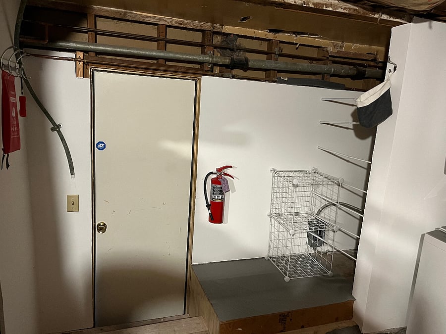 This is the back door to the apartment. On the right is the stacked washer dryer unit.