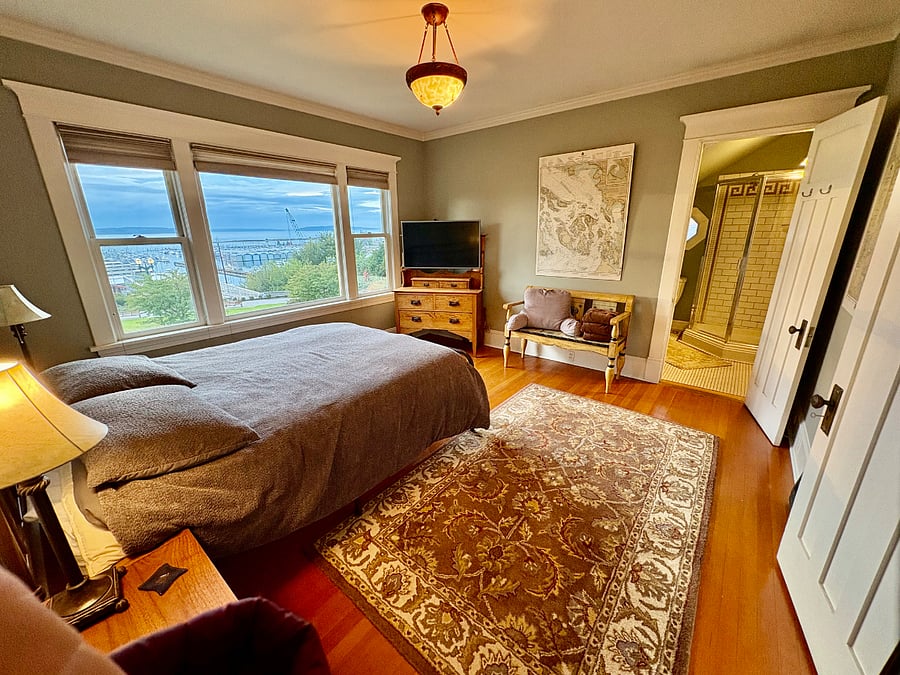 # 1 - Master Bedroom (facing west) with queen bed and private full bathroom with shower. Smart TV, walk in closet and view of the park & waterfront.
