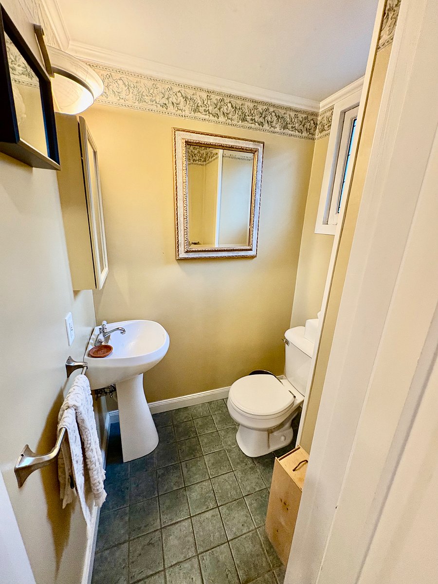 Main floor powder room off the bonus room.