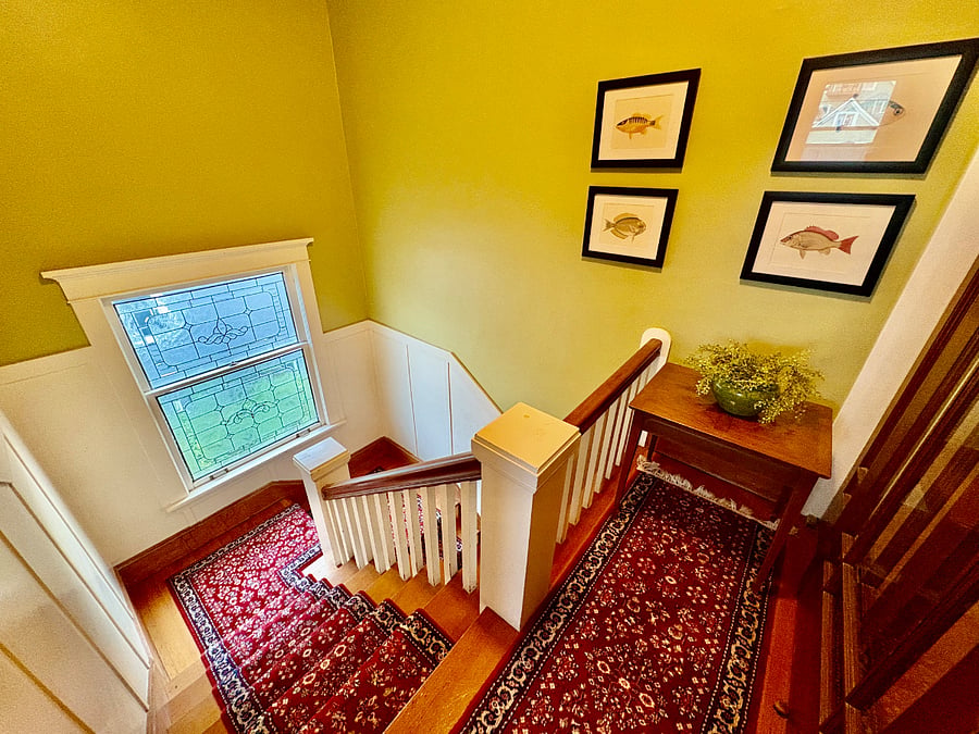 Stairwell leading to upstairs bedrooms and bath
