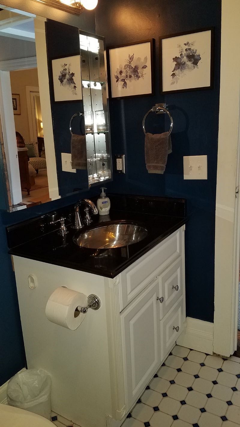Stainless sink and larger mirror.