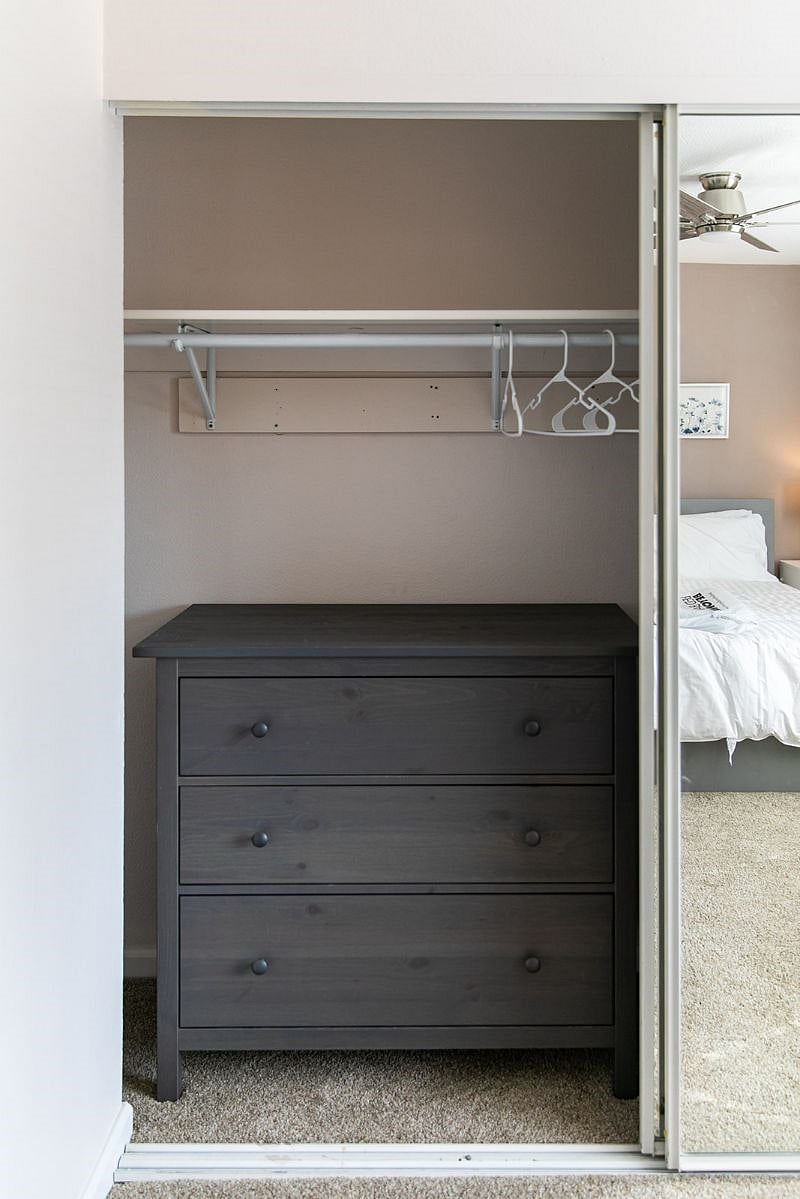 Master bedroom closet with dresser
