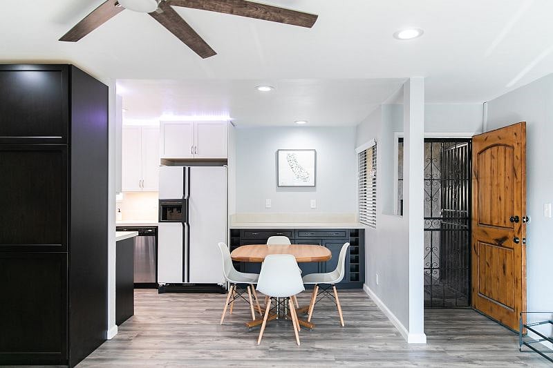 Kitchen, dining area, front door. Note the refrigerator has been replaced.