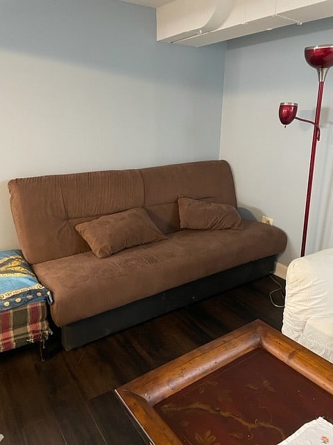 This couch pulls out into an additional bed - there is extra bedding on site