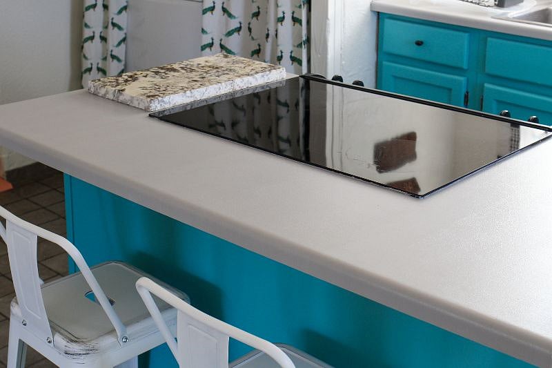 Counter seating for 2 in front of flat-top electric stove and oven at La Casita Ojita